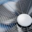 Close-up of air conditioner condenser fan operating in Rowlett TX